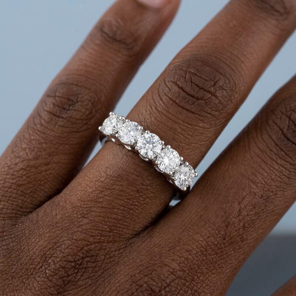 Hand model shot of the white gold diamond wedding band