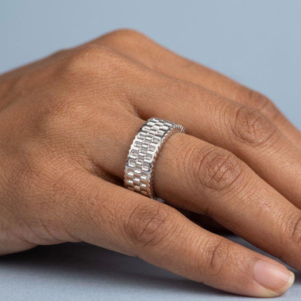 Hand model shot of the white gold Single French Cut Pave diamond wedding band