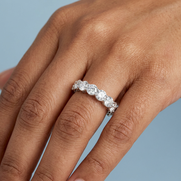 Hand model shot of the white gold Single French Cut Pave diamond wedding band