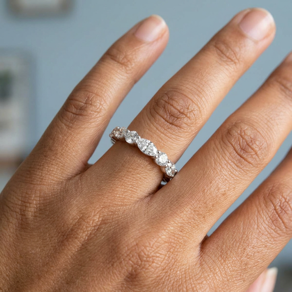 Hand model shot of the white gold Single French Cut Pave diamond wedding band