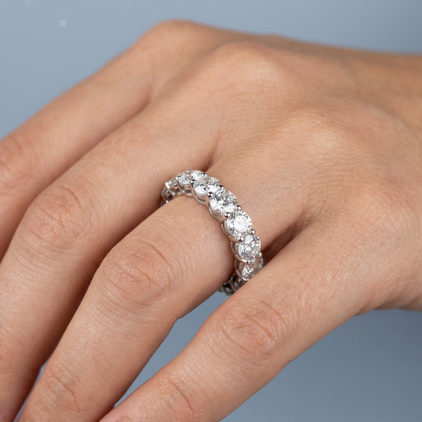 Hand model shot of the white gold Single French Cut Pave diamond wedding band