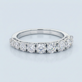 Round brilliant cut asymmetrical wedding band
