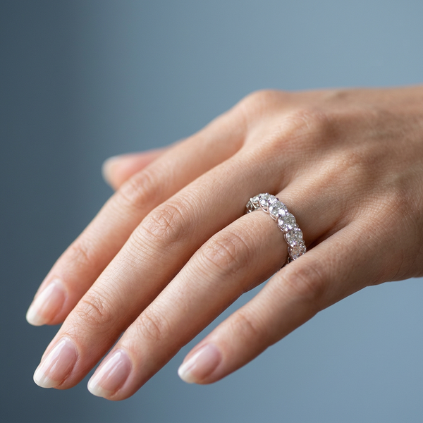 Hand model shot of the white gold Single French Cut Pave diamond wedding band