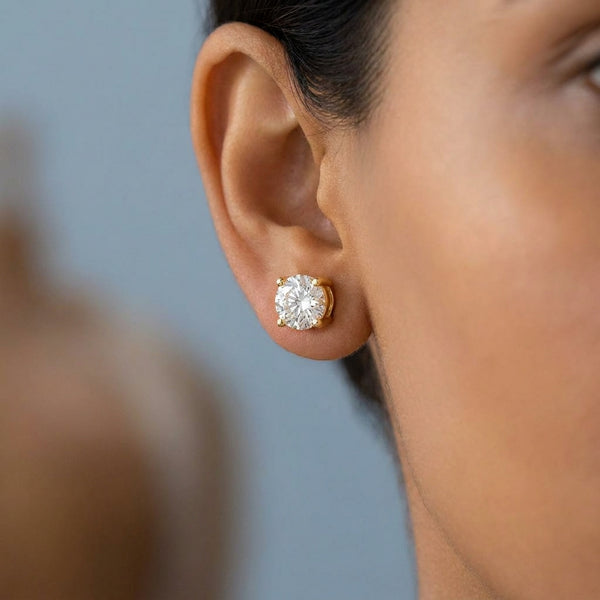 Model shot of the yellow gold earrings