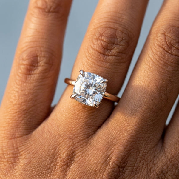 Hand model shot of the rose gold engagement ring