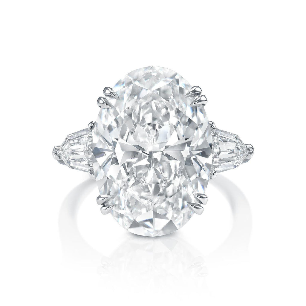Three stone oval cut diamond engagement ring