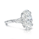 Three stone oval cut diamond engagement ring