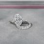 Three stone oval cut diamond engagement ring