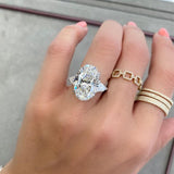 Three stone oval cut diamond engagement ring