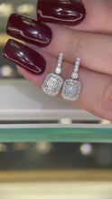 1.30 + carat Emerald Cut Lab Grown Diamond Earrings, set in the halo.