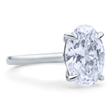 Clean Lines Oval Diamond Solitaire, with Rubies Inside.