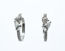 0.75 + carat Ideal Cut Round Brilliant + Pear Shape Cut Lab Grown Diamond Earrings, set in the halo.
