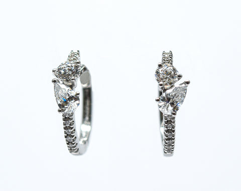 0.75 + carat Ideal Cut Round Brilliant + Pear Shape Cut Lab Grown Diamond Earrings, set in the halo.