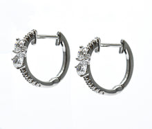 0.75 + carat Ideal Cut Round Brilliant + Pear Shape Cut Lab Grown Diamond Earrings, set in the halo.
